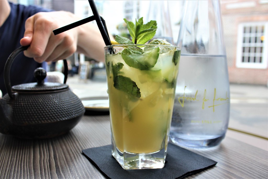 Non-alcoholic cocktail with mint served on a cafe table